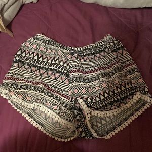 Pink black and white patterned kids shorts.